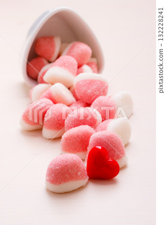 Pink jellies or marshmallows with sugar on table Pink jellies or marshmallows with sugar on table 132228241