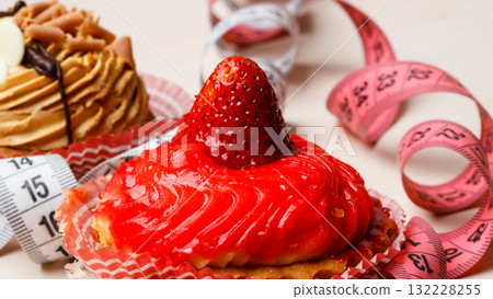cupcakes with measuring tapes on table cupcakes with measuring tapes on table 132228255