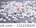 Colored heart-shaped topping sugar. Stylish and cute background decoration. Feelings. Imaginary landscape. 132228420
