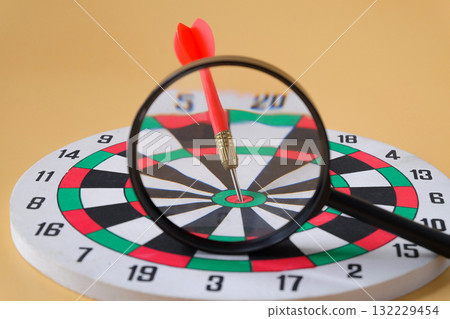 Dart board game with magnifying, Leader concept. Dart board game with magnifying, Leader concept. 132229454