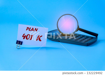 401K Plan text on whte note with magnifying glass. 401K Plan text on whte note with magnifying glass. 132229492