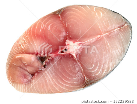 Close-up of a fresh raw fish steak, likely tuna or Spanish mackerel. Features firm pinkish flesh with visible muscle texture and central bone. Ideal for food concepts. 132229588