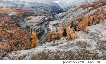 Amazing aerial view of beautiful bent river and low snow clouds Amazing aerial view of beautiful bent river and low snow clouds 132229813