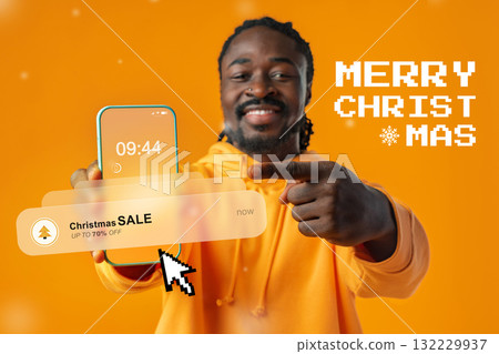 Man shows smartphone notification about Christmas sale in vibrant orange background Man shows smartphone notification about Christmas sale in vibrant orange background 132229937