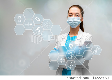 Medical professional stands confidently with healthcare icons in the background 132229974
