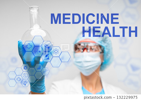Scientist in laboratory holding flask with focus on health and medicine concepts 132229975
