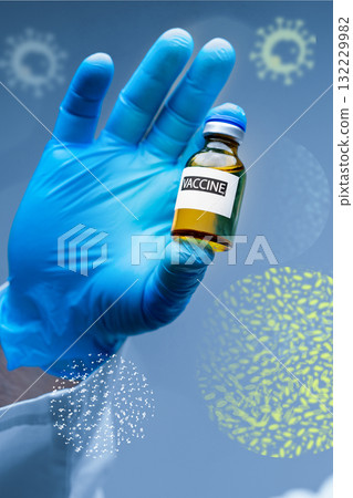 Health professional holds vaccine vial with blue glove against a creative background Health professional holds vaccine vial with blue glove against a creative background 132229982