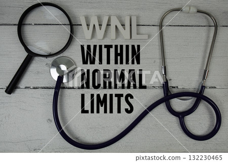 WNL Within Normal Limits text with Stethoscope on wooden background WNL Within Normal Limits text with Stethoscope on wooden background 132230465