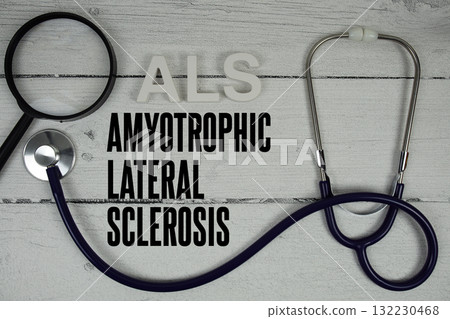 ALS Amyotrophic Lateral Sclerosis text with Stethoscope on wooden background 132230468