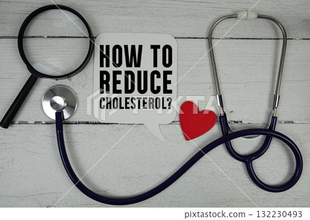 How To Reduce Cholesterol text with Red heart, Magnifying glass and Medical Stethoscope on wooden backgroundol How To Reduce Cholesterol text with Red heart, Magnifying glass and Medical Stethoscope on wooden backgroundol 132230493