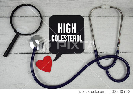 High Cholesterol text with Red heart, Magnifying glass and Medical Stethoscope on wooden background High Cholesterol text with Red heart, Magnifying glass and Medical Stethoscope on wooden background 132230500