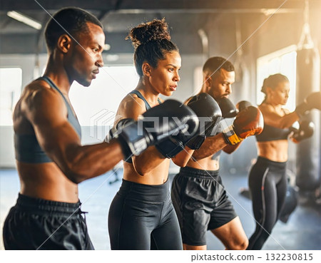 Diverse Group of Men and Women Boxing Together in Gym During Fitness Training 132230815