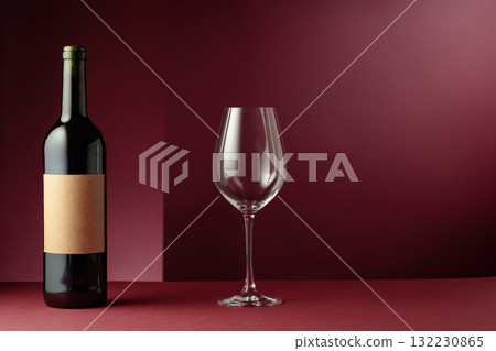Red wine on a dark red background. 132230865