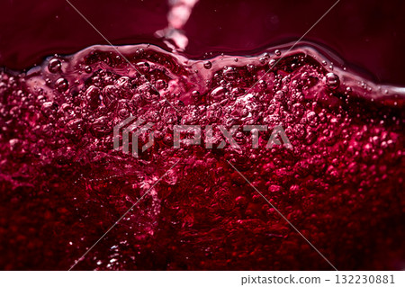 Macro shot of red wine in motion. 132230881