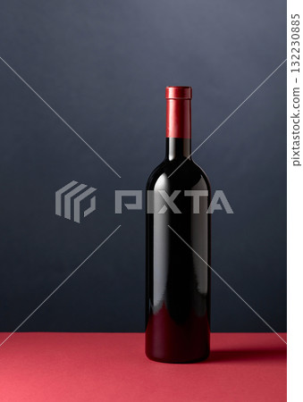 Bottle of red wine on a red table. Bottle of red wine on a red table. 132230885