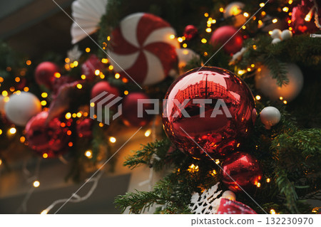 Red balls on a Christmas tree branches 132230970