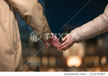 A couple connecting hands 132230987