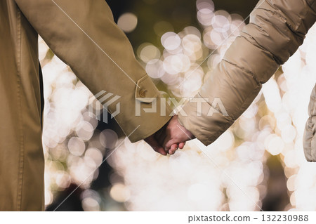 A couple connecting hands 132230988