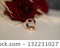 Romantic Wedding Rings on Red Dahlia Blossom Rose Gold Bands, Love, Commitment, Ceremony, Floral Arrangement, Soft Focus, Elegant Style. 132231027