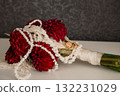 Dramatic Red Dahlia Wedding Bouquet with White Floral Garland and Gold Rings Romantic Ceremony Still Life Photography. 132231029