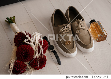 Groom Wedding Details: Beige Boat Shoes, Boutonniere, Watch and Cologne Rustic Elegant Flat Lay, Burgundy and Brown Tones Groom Wedding Details: Beige Boat Shoes, Boutonniere, Watch and Cologne Rustic Elegant Flat Lay, Burgundy and Brown Tones 132231031