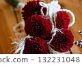 Deep Burgundy Dahlia Wedding Bouquet with White Ribbon Wrap. Rustic Floral Arrangement. Close-Up Photography. Dramatic Lighting. Romantic Style 132231048