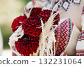 Traditional Ukrainian Wedding Garland of Red Dahlias and Beaded Necklace Detail, Close-Up Embroidery and Floral Arrangement. 132231064