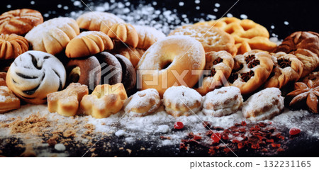 still life of cookies with chocolate on a wooden table, dark background, delicious pastries 132231165