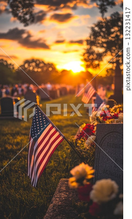 Sunset at a Cemetery With Flowers and an American Flag Honoring Veterans 132231417