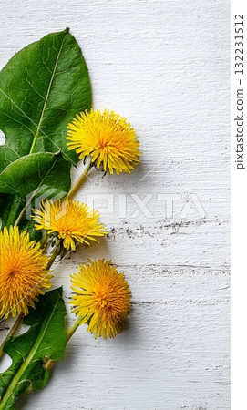 Bright Yellow Dandelions and Green Leaves Arranged on a Wooden Surface During Springtime 132231512