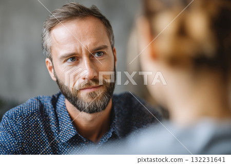 Therapist listening to patient during mental health counseling session Therapist listening to patient during mental health counseling session 132231641