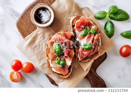 Delicious Bread Topped With Prosciutto and Basil During a Leisurely Afternoon 132231704