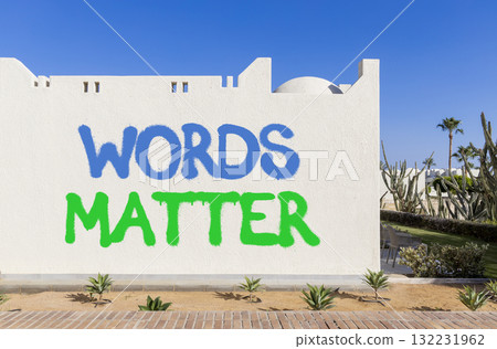 Words matter symbol. Concept word Words matter on beautiful white wall. Beautiful blue sky background. Business words matter concept. Copy space. Words matter symbol. Concept word Words matter on beautiful white wall. Beautiful blue sky background. Business words matter concept. Copy space. 132231962