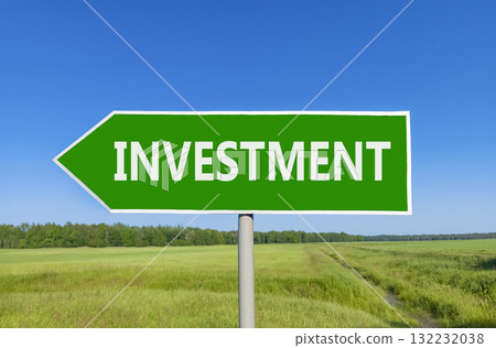 Investment symbol. Concept word Investment on beautiful green road sign. Beautiful blue sky green grass and forest peaceful nature background. Business investment concept. Copy space. 132232038
