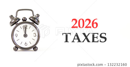 2026 taxes new year symbol. Concept words 2026 taxes on beautiful white paper. Beautiful white paper background. Beautiful black alarm clock. Business and 2026 taxes new year concept. Copy space. 2026 taxes new year symbol. Concept words 2026 taxes on beautiful white paper. Beautiful white paper background. Beautiful black alarm clock. Business and 2026 taxes new year concept. Copy space. 132232160