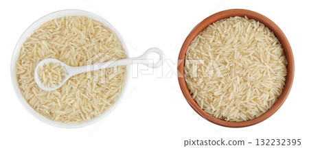 rice basmati in a ceramic bowl isolated on white background. Top view. Flat lay 132232395