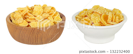 Cornflakes in wooden and ceramic bowl isolated on white background. Cornflakes in wooden and ceramic bowl isolated on white background. 132232400