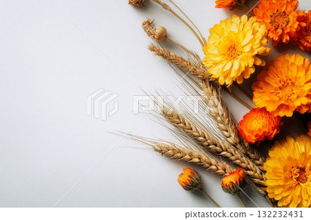 Bright Yellow and Orange Flowers With Wheat on Neutral Background for Seasonal Decor Bright Yellow and Orange Flowers With Wheat on Neutral Background for Seasonal Decor 132232431