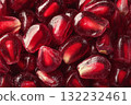 Fresh Ruby Red Pomegranate Seeds Scattered on a Smooth Surface 132232461