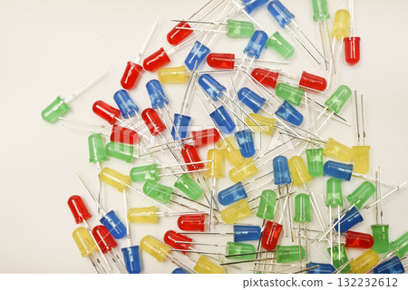 A scattering of LEDs. Multi-colored LEDs in bags. Electronic elements. 132232612