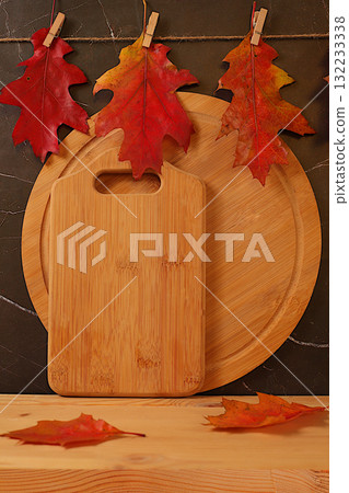 A creative autumn composition and banner for design. An empty, modern, elegant food display table with maple leaves, a minimalist autumn concept. A Happy Thanksgiving greeting card 132233338