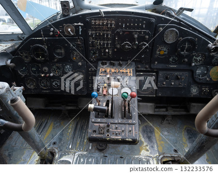 colorful cockpit controls, aged cockpit featuring colorful knobs and tactile grips, brightly colored throttle controls with worn paint and tactile grips in old cockpit colorful cockpit controls, aged cockpit featuring colorful knobs and tactile grips, brightly colored throttle controls with worn paint and tactile grips in old cockpit 132233576