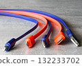 Colorful USB, Micro USB, and Type-C charging cables on gray background for technology and connection 132233702