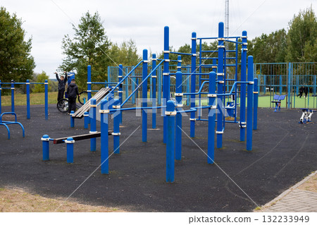 Urban sports ground with exercise equipment for sports. Various close-up simulators on the playground 132233949