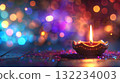 Candle light Diya oil lamps and colorful bokeh background. Scene is serene and calming. Warm and inviting Diwali mood. Copy place 132234003