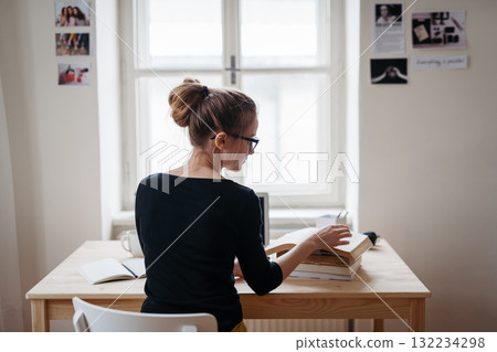 Rear view of student during study session. 132234298