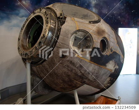 charred capsule exhibits engineering resilience, exterior of burnt reentry capsule showcases resilience, display of scorched capsule highlights orbital recovery heritage and resilience 132234509