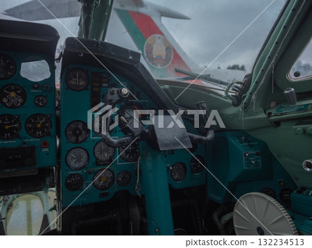 flightdeck side view with livery visible through windscreen, copilot station and console details, tail insignia framed by exterior light, museum parking mood and restoration narrative flightdeck side view with livery visible through windscreen, copilot station and console details, tail insignia framed by exterior light, museum parking mood and restoration narrative 132234513