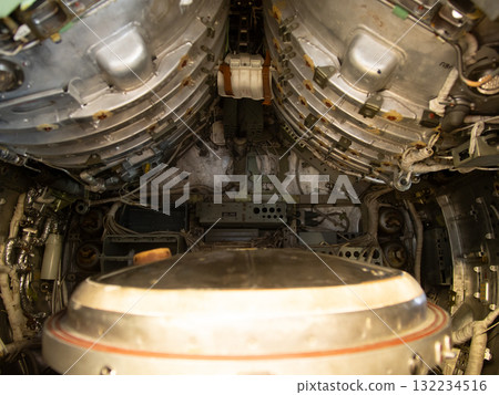 rusty turbine area, corroded turbine chamber featuring tangled wiring and rust accumulation, rusty turbine engine area showing corrosion and chaotic wiring in compartment surroundings 132234516