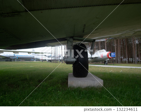 vintage airplane wheel and environment, details of old airplane wheels and their surroundings, historical aircraft wheel specifications along with surrounding components and context 132234611